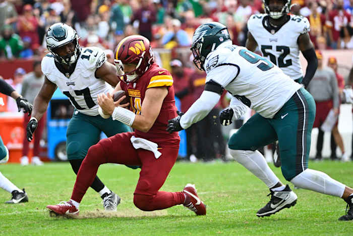 Sam Howell sliding against the Philadelphia Eagles. 